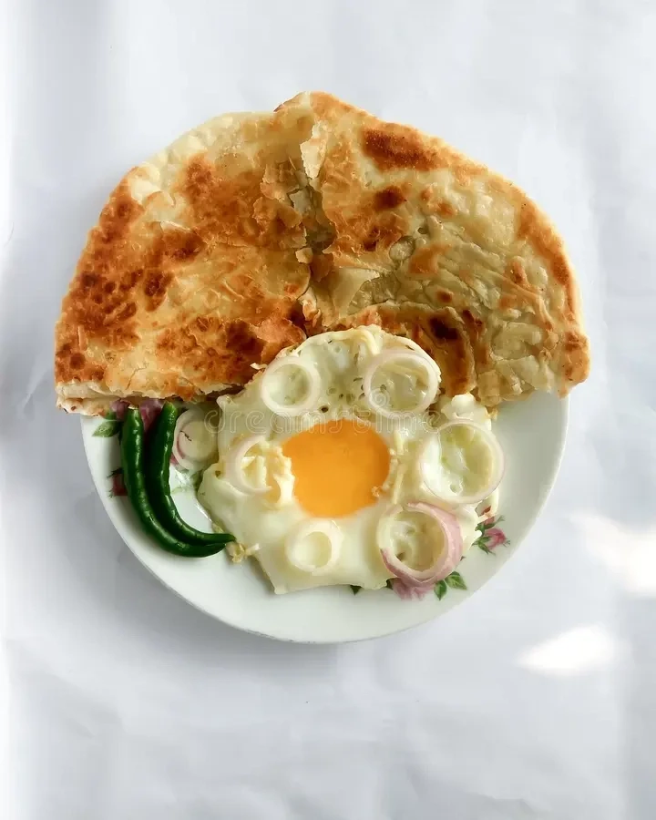 Break fast iv (Fried egg+Plain Pratha)